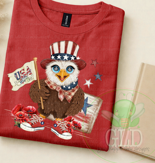 Red t-shirt featuring Uncle Beaky patriotic eagle graphic with patriotic hat, USA flag and red poppy flowers